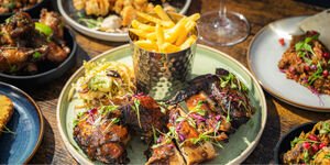 A photograph of colourful food in small dishes