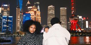 Image of two people posing in front of the Shanghai skyline.