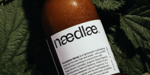 Image of a hair spray on a bed of nettle.