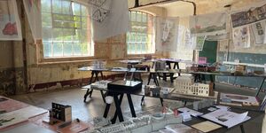 Image of Interior Educators at Bargehouse, with tables on display.