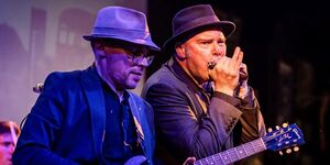 Image of two musicians on stage.