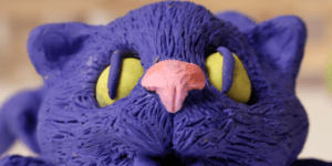Clay mould of a purple cat.