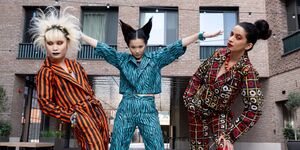 Image of 3 people wearing red and blue outfits.