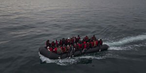 Image of a boat floating on the sea.