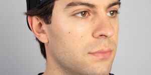 Image of a man wearing a black plastic headband.