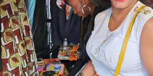 Image of a woman smiling at a Book Club.