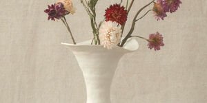 Image of a white vase holding flowers.