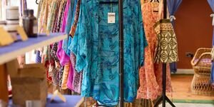 Image of a clothing rack in a shop.