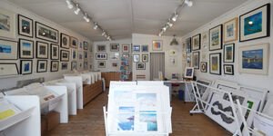 Image of the gallery with prints on display.