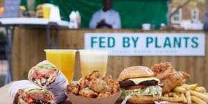 Image of a stack of vegan food and fruit smoothies.