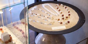Image of a set of necklaces on display.