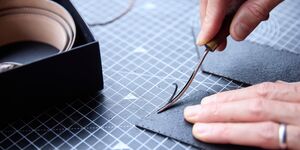 Image of someone making a wallet.