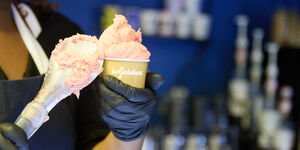 Image of someone scooping ice cream.