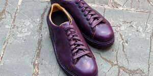 An image of brown bespoke leather sneakers.