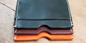 Image of a trio of card cases stacked in different colours.