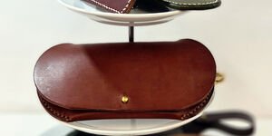 Image of a tray stacked with leather items.