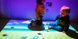 Image of two children playing in a sensory room.