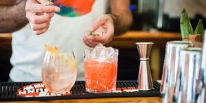 Image of a bartender making a cocktail.