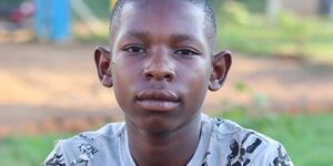 Portrait image of a young boy looking at the camera.