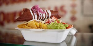 A white carton filled with food