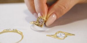 Image of someone holding a ring.