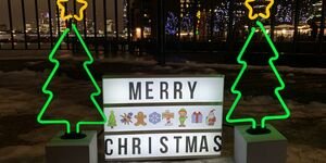 Image of neon lights shaped as Christmas trees