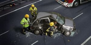 Image of traffic officers attending a car crash.