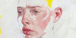 Half finished painting of a woman's face.