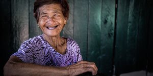 Image of an elderly Cambodian woman smiling.
