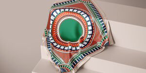 An image of a green scarf on a staircase.