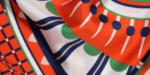 A close up image of an orange scarf.