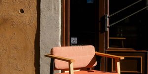 Image of a chair in the sun.