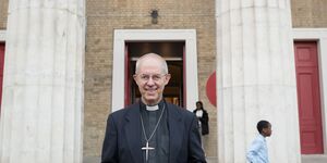 Giles the Vicar outside the church