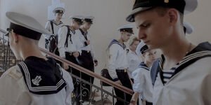 Image of sailors walking down the stairs.