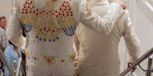 Two people walking down the stairs