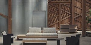 Image of a room with a sofa wood walls.