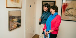 Image of two people in a gallery.