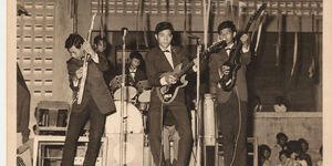 1960's vintage photo of a band playing in Cambodia.