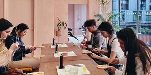 A group of people working together in a workshop.