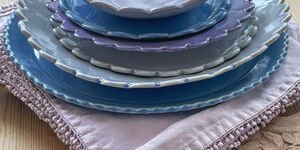 A stack of blue ceramic plates.