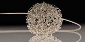 A piece of JeDeCo jewellery with a black background.