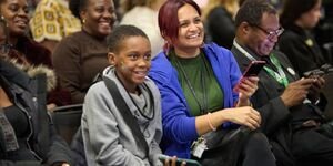 a young person and youth worker play games together