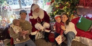 A family visiting Santa's Grotto at Coin Street