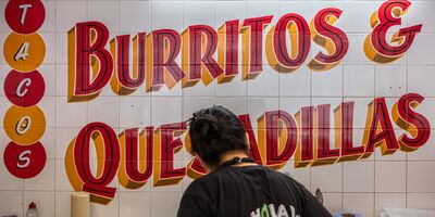 An image of the restaurant with a sign that says Burritos and Quesadillas.