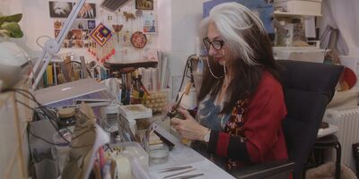 An image of Sima working in her studio.