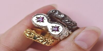 An image of someone holding a ring.