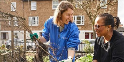 An image of Laura gardening with a participant in the session.