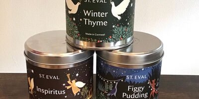 Image of three scented candles stacked on top of each other.