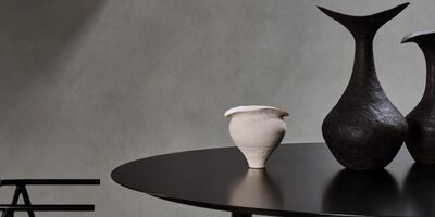 Image of black and white ceramics on a black table.