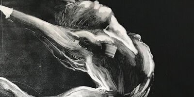 Black and white print of a woman dancing.